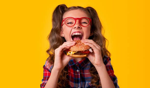 Child enjoying a hamburger Happy Meal